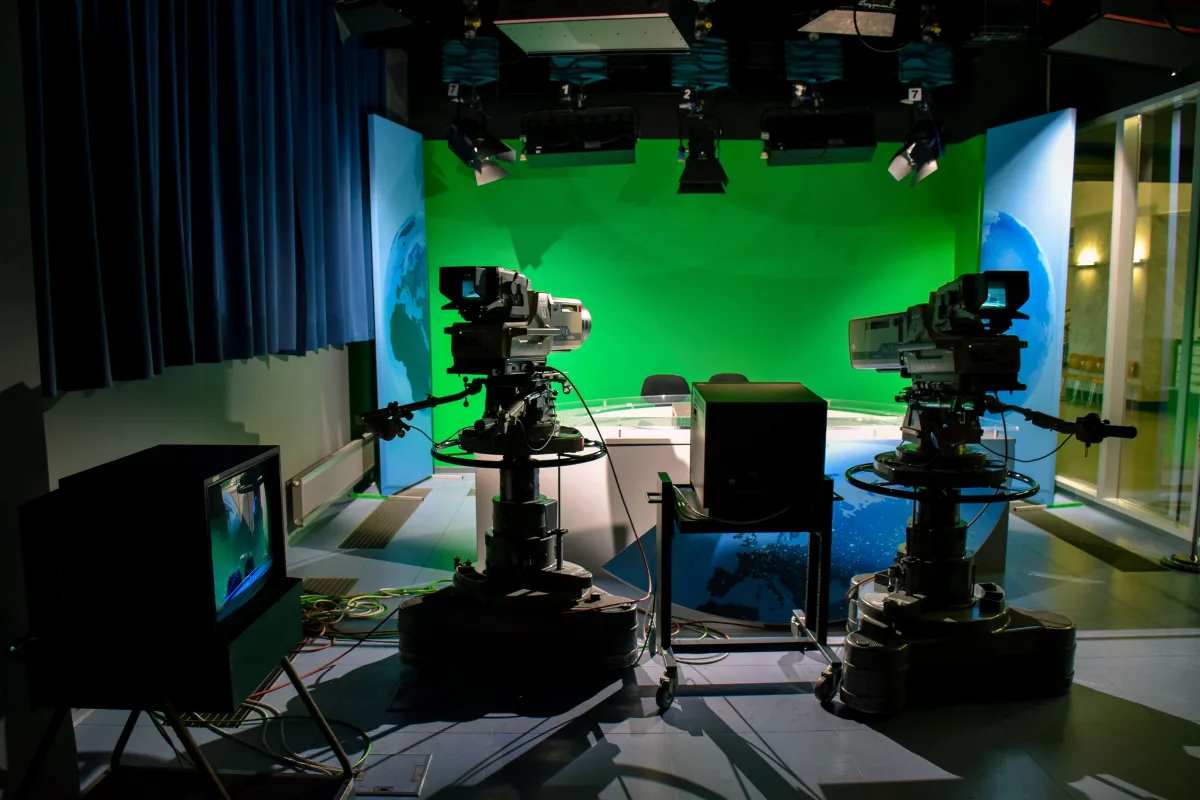 Television production studio with broadcast cameras